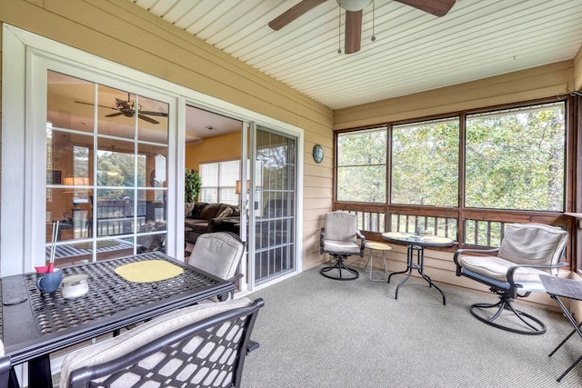 sunroom / solarium with ceiling fan