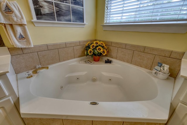 bathroom featuring tiled bath