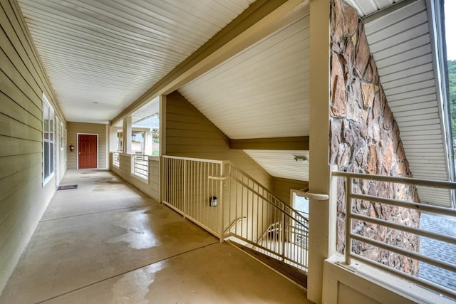 corridor with vaulted ceiling