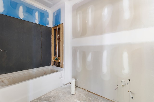 bathroom with concrete flooring