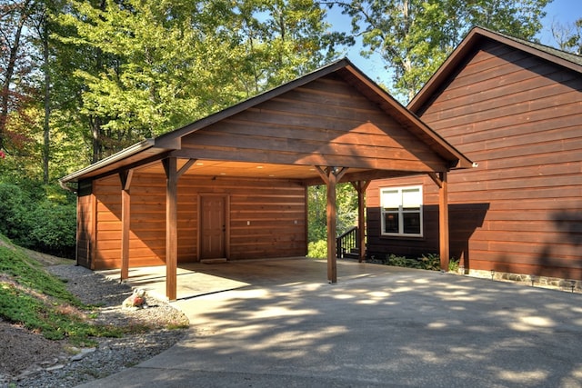 36 Rustic Barn Trl, Morganton, GA 30560 - view of vehicle parking with concrete driveway and a detached carport