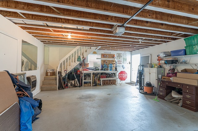 interior space featuring stairway and heating unit