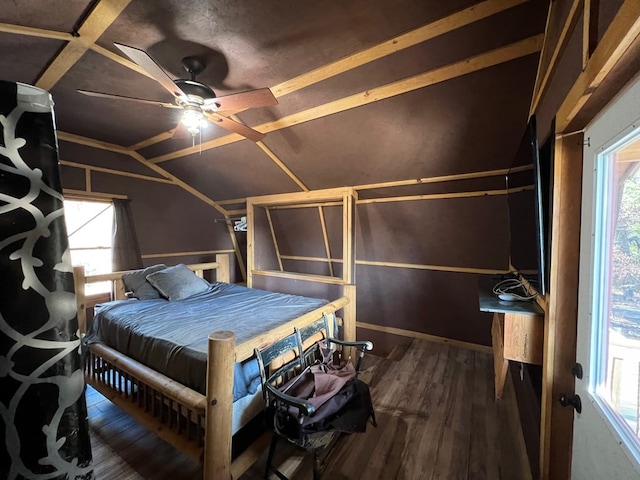 unfurnished bedroom featuring lofted ceiling and dark hardwood / wood-style flooring