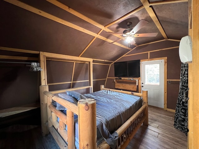 bedroom featuring hardwood / wood-style flooring and vaulted ceiling