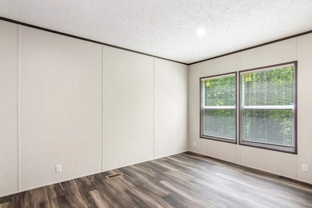 251 Ebenezer Rd, Ellijay, GA 30536 - spare room featuring ornamental molding, a textured ceiling, a decorative wall, and wood finished floors
