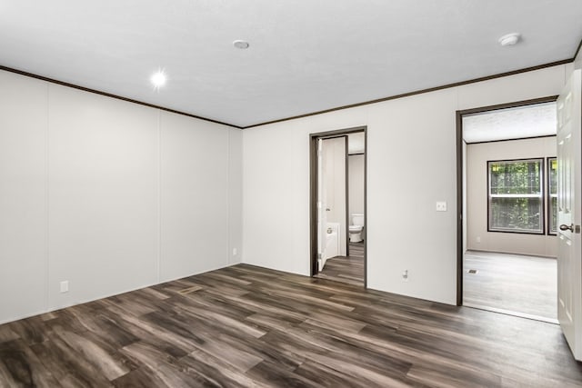 251 Ebenezer Rd, Ellijay, GA 30536 - unfurnished bedroom with dark wood-style flooring, ensuite bathroom, and crown molding