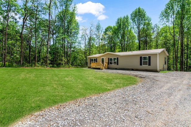 251 Ebenezer Rd, Ellijay, GA 30536 - manufactured / mobile home with gravel driveway, a front yard, a wooden deck, and crawl space