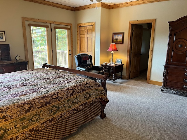 bedroom featuring access to exterior and light colored carpet