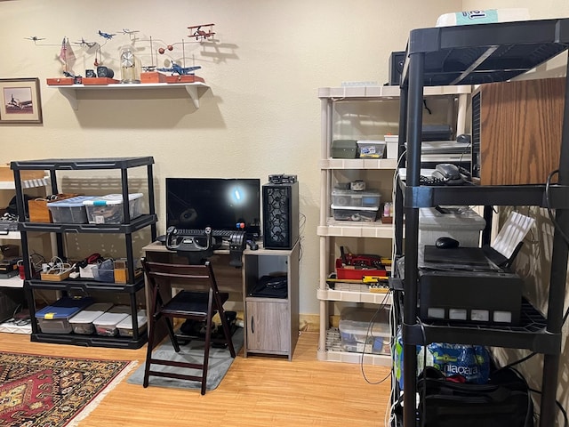 home office with hardwood / wood-style floors