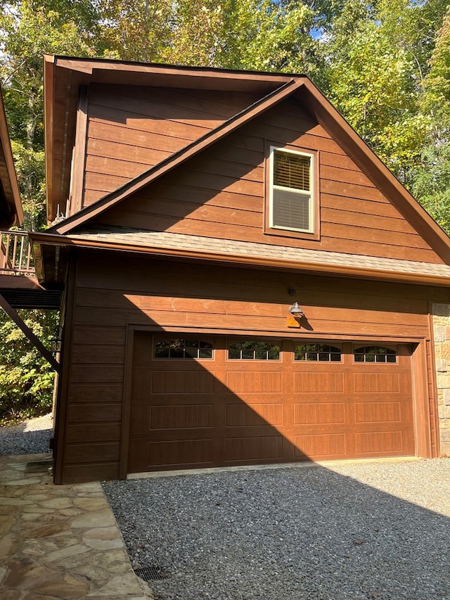 garage featuring wood walls