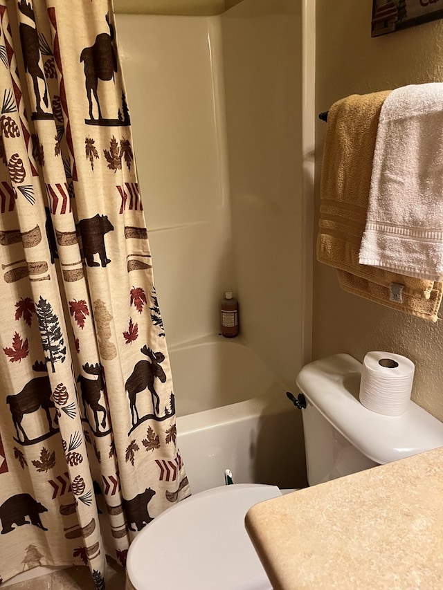 bathroom with shower / bath combo with shower curtain and toilet