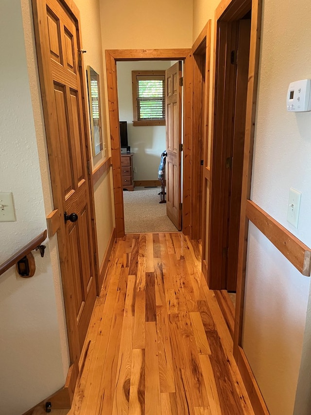 corridor featuring light hardwood / wood-style flooring