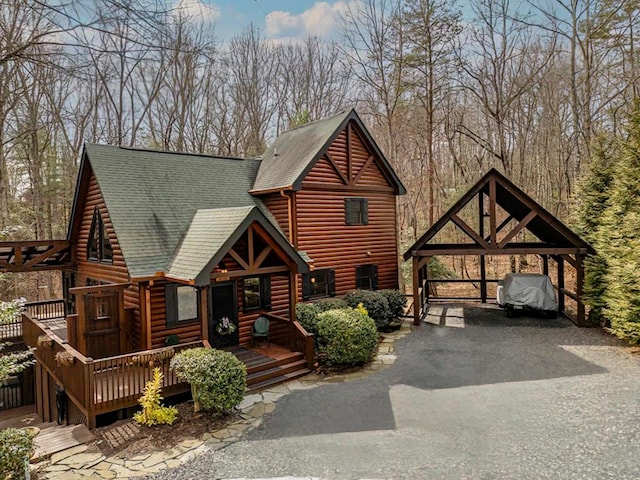 view of front of home featuring a shingled roof