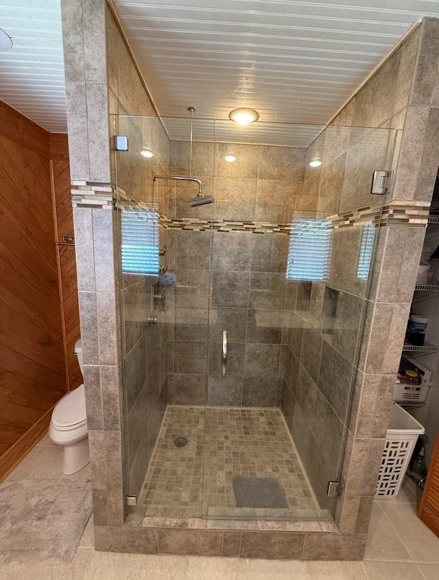 369 Deals Gap Rd, Robbinsville, NC 28771 - bathroom with tile patterned flooring, a stall shower, and toilet
