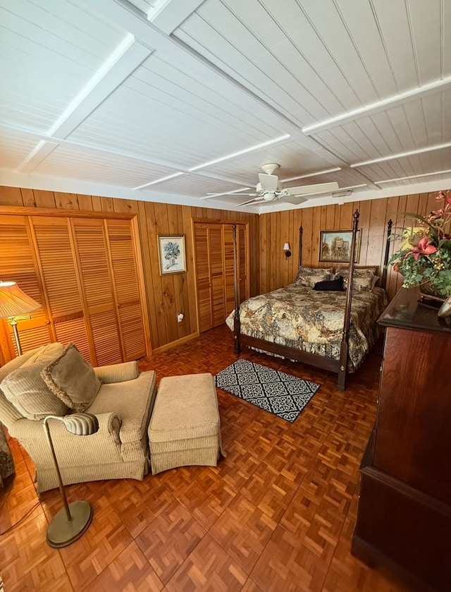 369 Deals Gap Rd, Robbinsville, NC 28771 - bedroom featuring wood walls and a ceiling fan