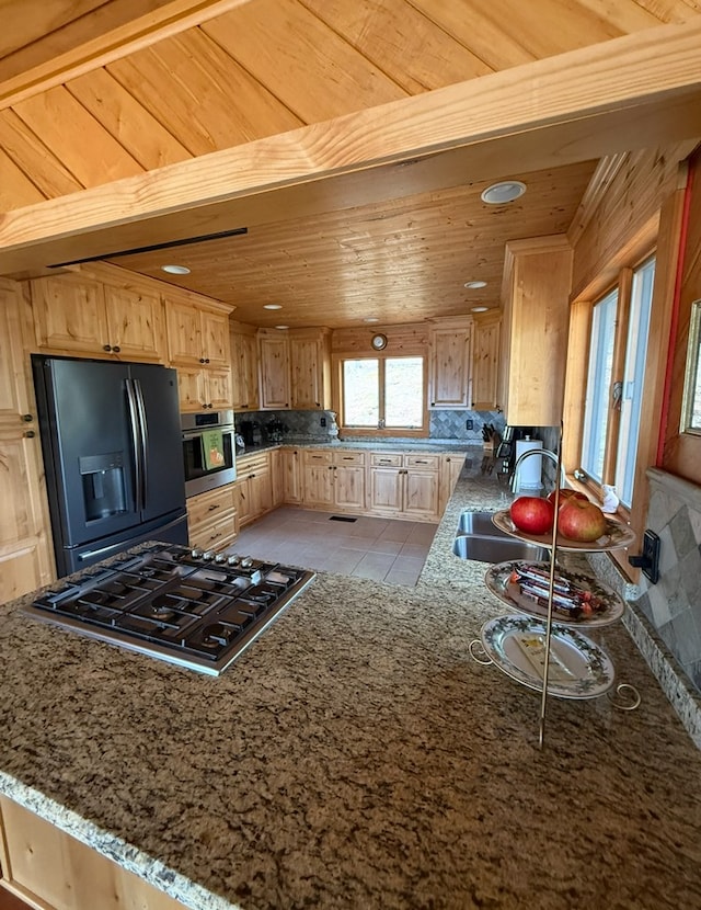 369 Deals Gap Rd, Robbinsville, NC 28771 - kitchen featuring light stone countertops, wooden ceiling, light brown cabinetry, and stainless steel appliances