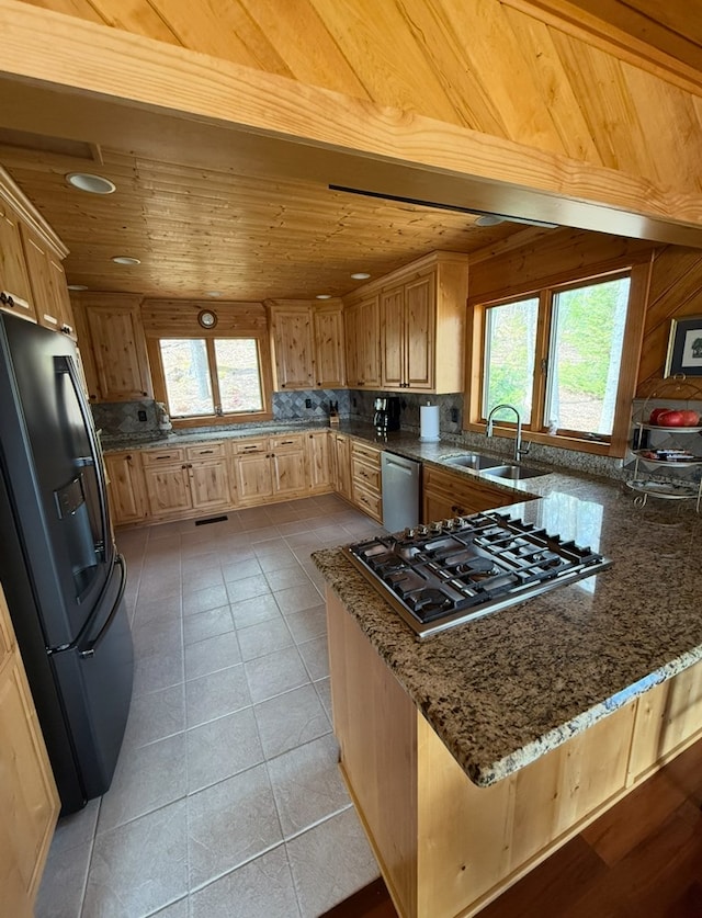 369 Deals Gap Rd, Robbinsville, NC 28771 - kitchen with wooden ceiling, a sink, appliances with stainless steel finishes, a peninsula, and stone counters