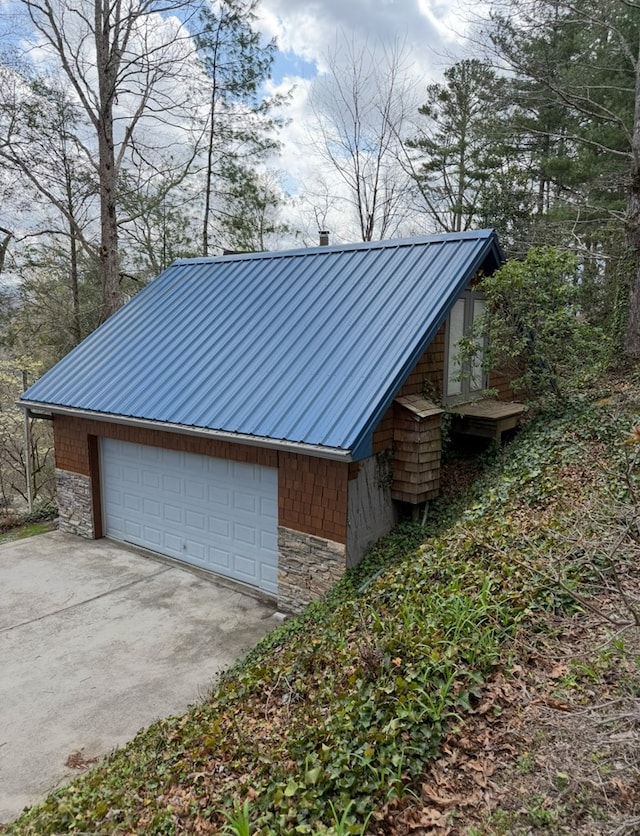 369 Deals Gap Rd, Robbinsville, NC 28771 - exterior space with stone siding, metal roof, and a garage