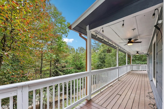 wooden terrace featuring ceiling fan