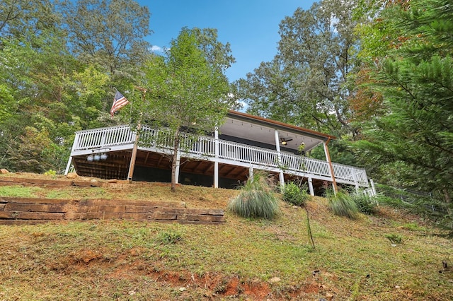 back of house featuring a deck