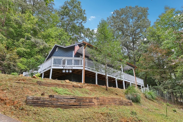 rear view of property featuring a deck