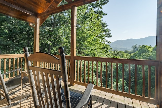 wooden deck featuring a mountain view