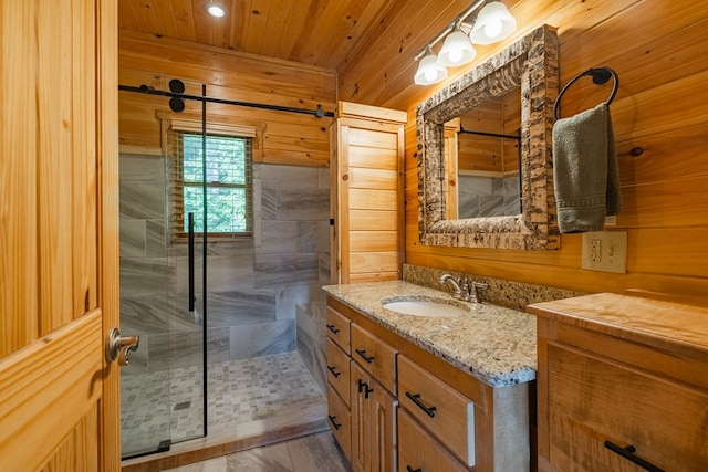 bathroom featuring vanity, wooden ceiling, wooden walls, and walk in shower