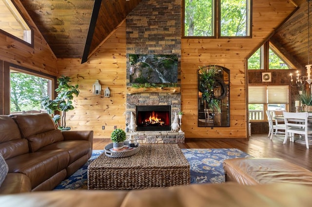 9 Quail Holw, Blue Ridge, GA 30513 - living area featuring wooden ceiling, hardwood / wood-style floors, a stone fireplace, wood walls, and high vaulted ceiling