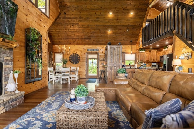 9 Quail Holw, Blue Ridge, GA 30513 - living area featuring high vaulted ceiling, wooden walls, hardwood / wood-style floors, a fireplace, and wood ceiling
