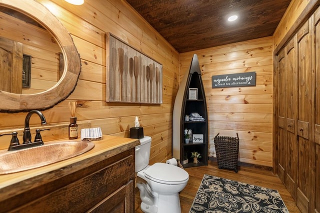 9 Quail Holw, Blue Ridge, GA 30513 - half bathroom featuring wooden ceiling, wooden walls, vanity, wood finished floors, and recessed lighting