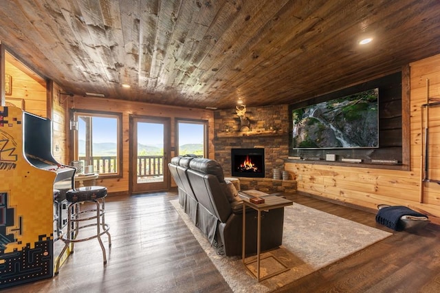 9 Quail Holw, Blue Ridge, GA 30513 - living area featuring a stone fireplace, wooden ceiling, wood finished floors, wood walls, and recessed lighting