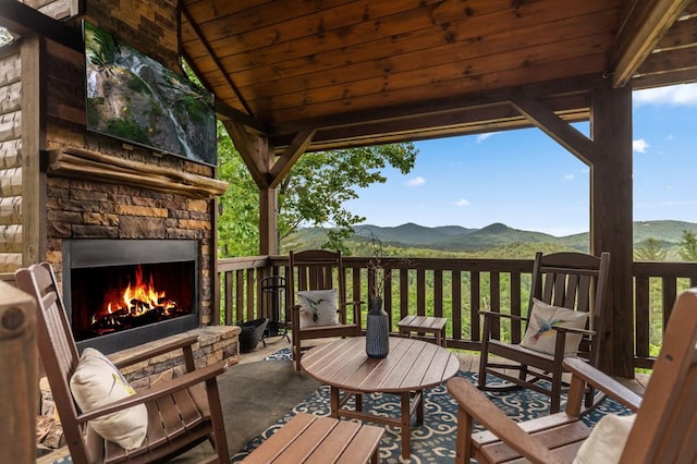 9 Quail Holw, Blue Ridge, GA 30513 - wooden deck featuring an outdoor stone fireplace and a mountain view