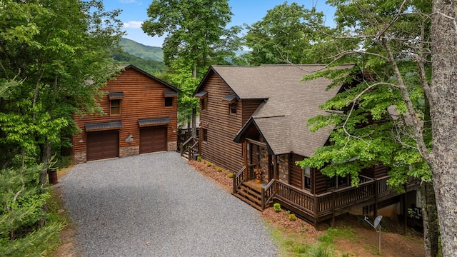 9 Quail Holw, Blue Ridge, GA 30513 - rustic home with gravel driveway, a shingled roof, stone siding, and a mountain view