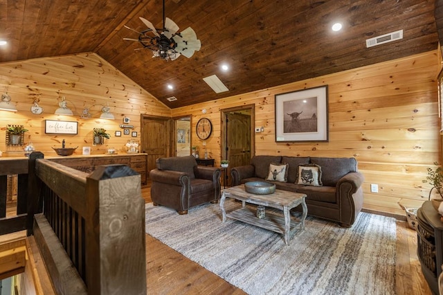 9 Quail Holw, Blue Ridge, GA 30513 - living room featuring wood finished floors, vaulted ceiling, wood walls, wooden ceiling, and a ceiling fan