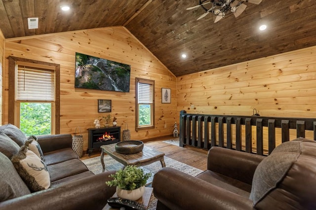 9 Quail Holw, Blue Ridge, GA 30513 - living room featuring vaulted ceiling, wooden ceiling, a ceiling fan, wood walls, and hardwood / wood-style flooring