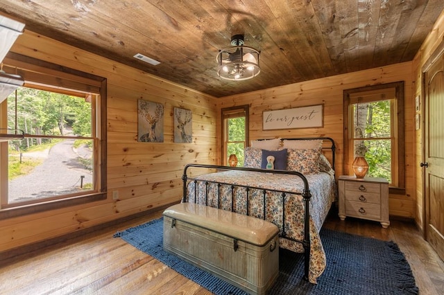 9 Quail Holw, Blue Ridge, GA 30513 - bedroom with wooden ceiling, wooden walls, and wood-type flooring