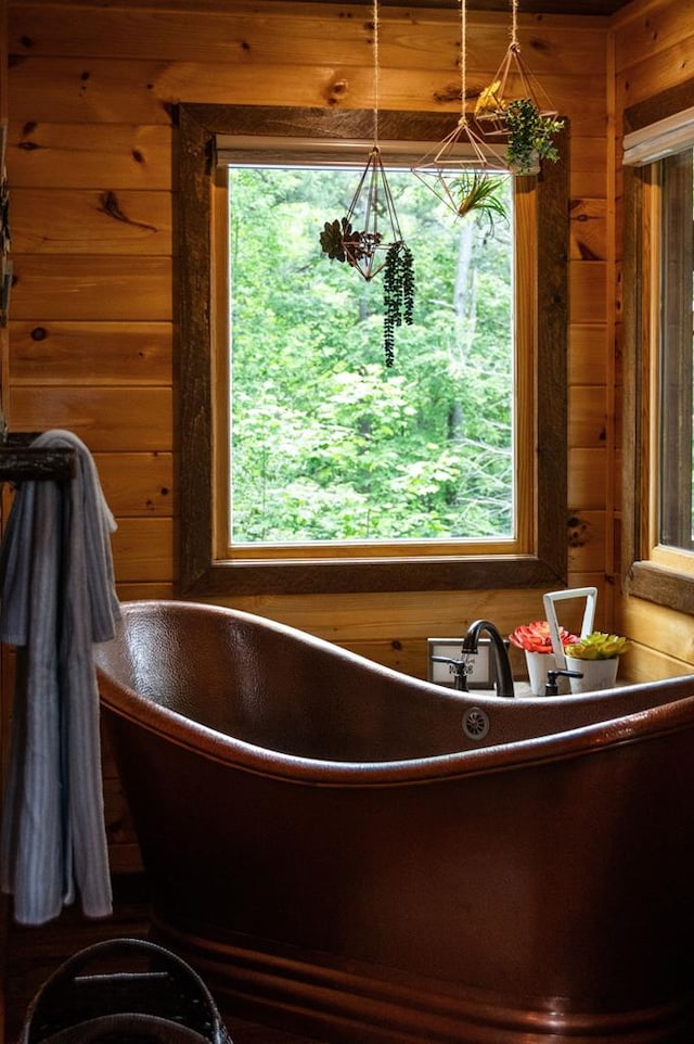 9 Quail Holw, Blue Ridge, GA 30513 - bathroom with wooden walls and a freestanding tub