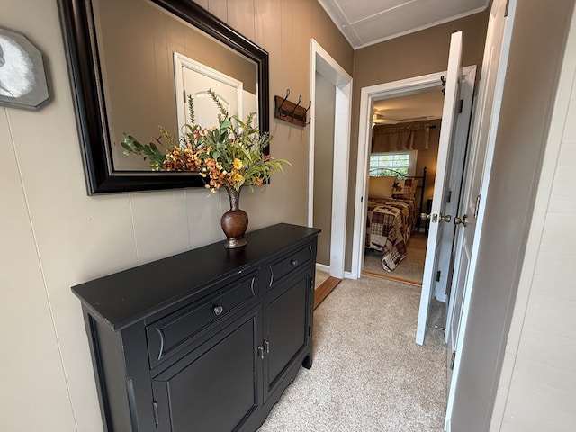 corridor featuring crown molding