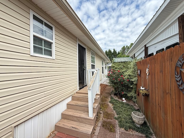 view of side of property with fence
