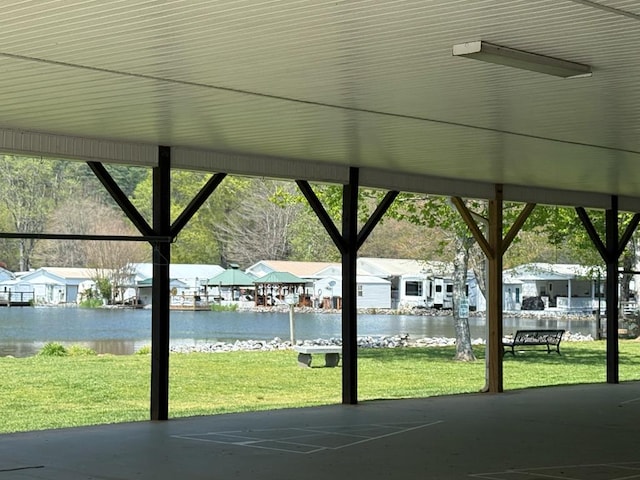 exterior space featuring a residential view and a water view