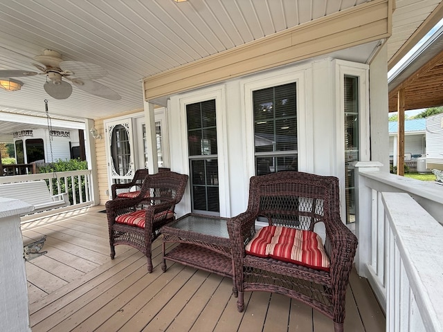 wooden deck featuring ceiling fan