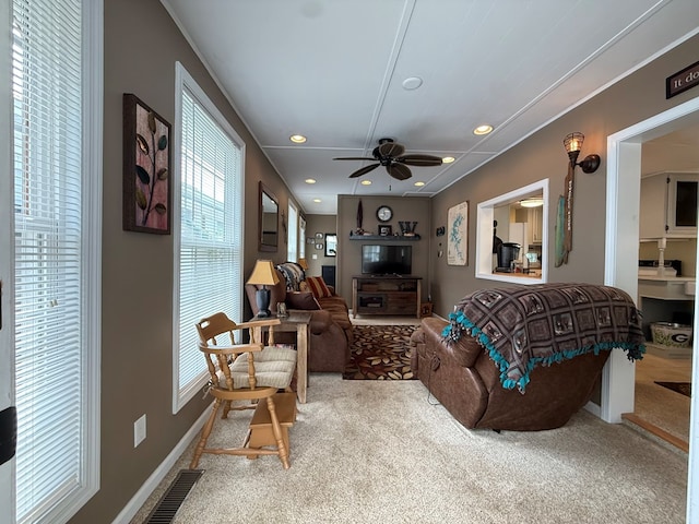 living area with carpet floors, a ceiling fan, visible vents, and recessed lighting
