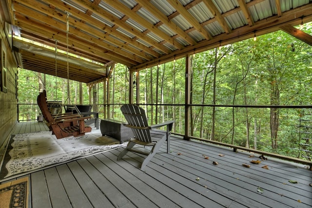wooden deck featuring a view of trees