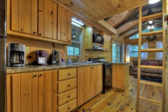kitchen featuring black appliances, light wood-style flooring, a sink, wooden ceiling, and vaulted ceiling with beams