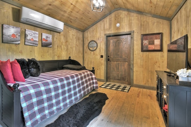 bedroom with lofted ceiling, wood ceiling, wood walls, and a wall mounted AC