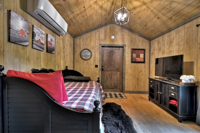 bedroom with vaulted ceiling, wooden walls, wood ceiling, and a wall mounted air conditioner