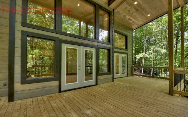 unfurnished sunroom with french doors, vaulted ceiling, and wood ceiling