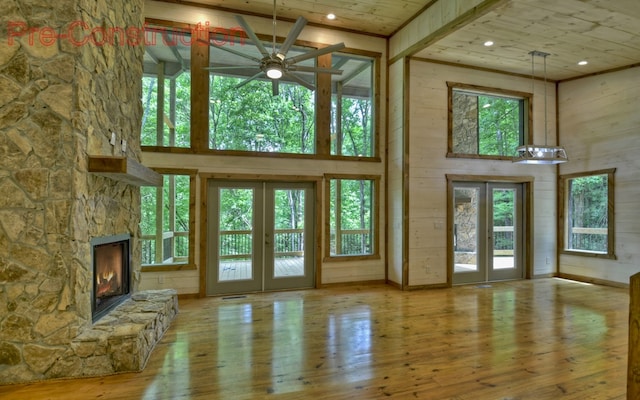 doorway featuring french doors, light hardwood / wood-style flooring, and a healthy amount of sunlight