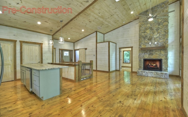 kitchen featuring light hardwood / wood-style flooring, a kitchen island, wooden ceiling, and high vaulted ceiling