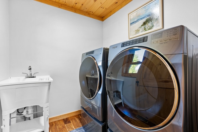 laundry room with wood ceiling, wood-type flooring, and independent washer and dryer